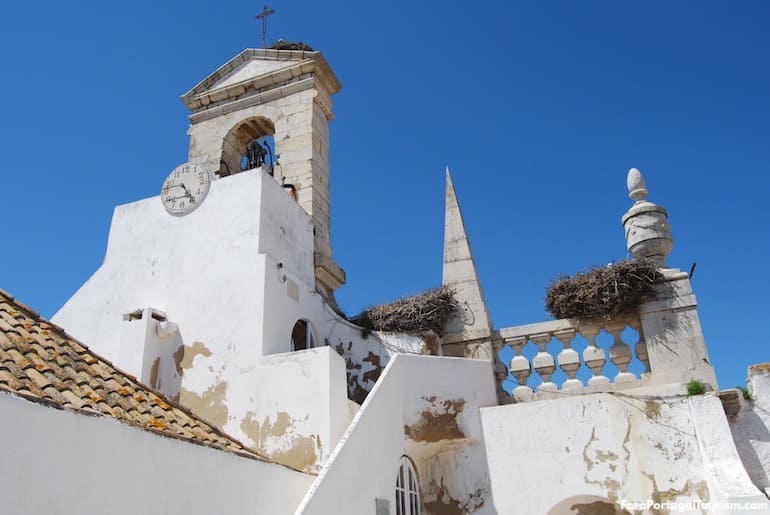 Stork nests at the top of the arch, Faro